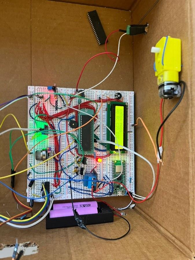 Smart home hardware prototype with PIC board, LCD and motor